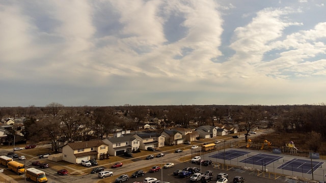 birds eye view of property with a residential view