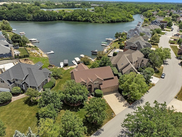 birds eye view of property featuring a water view and a residential view