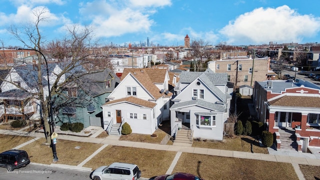 birds eye view of property with a residential view