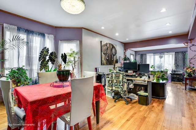 dining area with ornamental molding, recessed lighting, and hardwood / wood-style floors