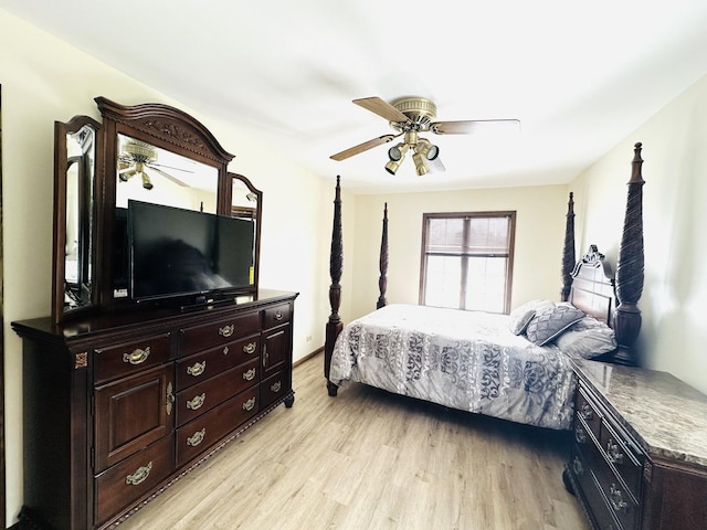 bedroom with light wood-style floors and a ceiling fan