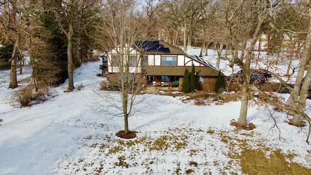 view of front of property featuring solar panels