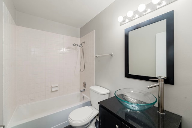 bathroom with toilet, tub / shower combination, and vanity