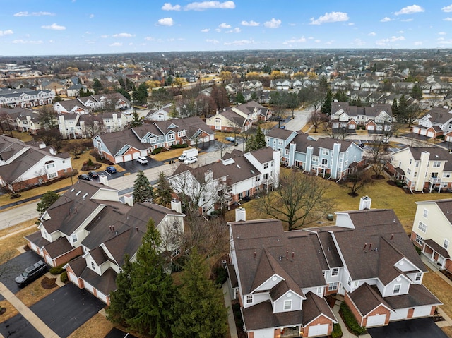 birds eye view of property with a residential view