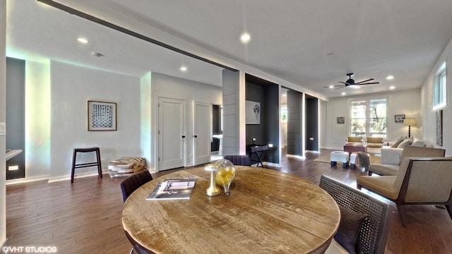 interior space with a ceiling fan, baseboards, wood finished floors, and recessed lighting