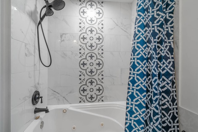 bathroom with a combined bath / shower with jetted tub