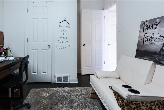 interior space featuring wood finished floors and visible vents