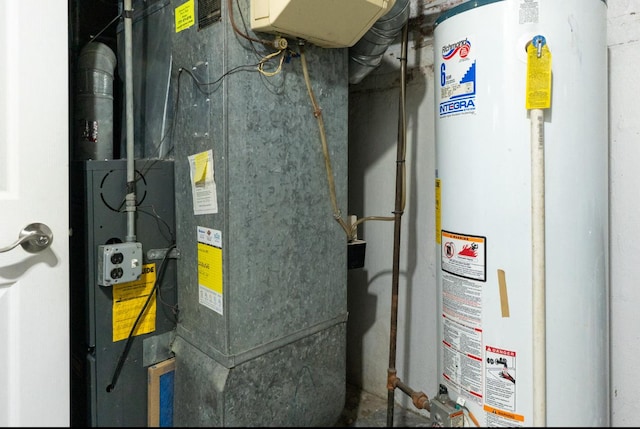 utility room featuring water heater