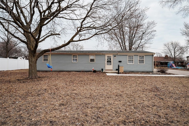 single story home with fence