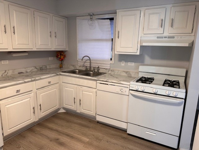 kitchen featuring dark wood-style flooring, white cabinetry, a sink, white appliances, and under cabinet range hood