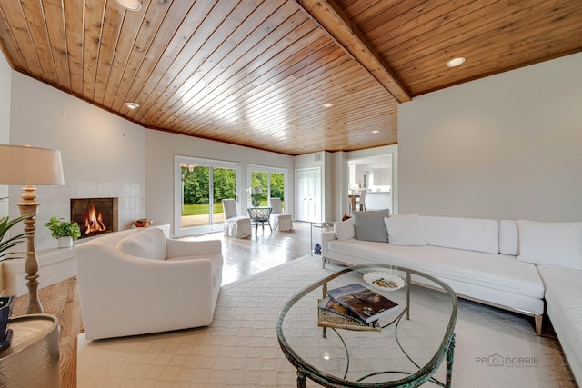 living room with crown molding, wooden ceiling, a fireplace, and recessed lighting