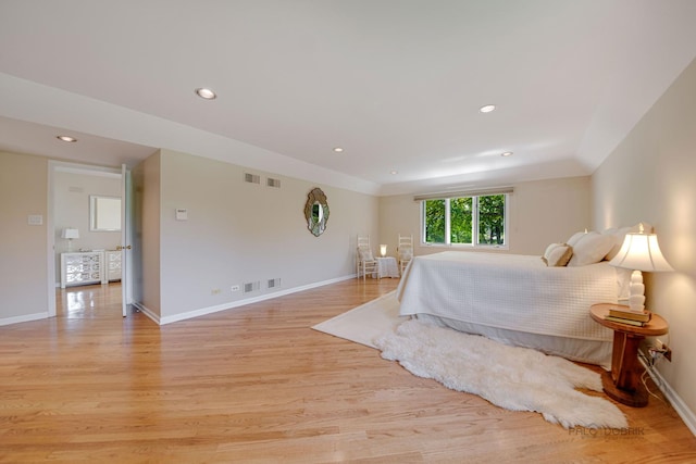 bedroom with light wood-style floors, recessed lighting, and baseboards