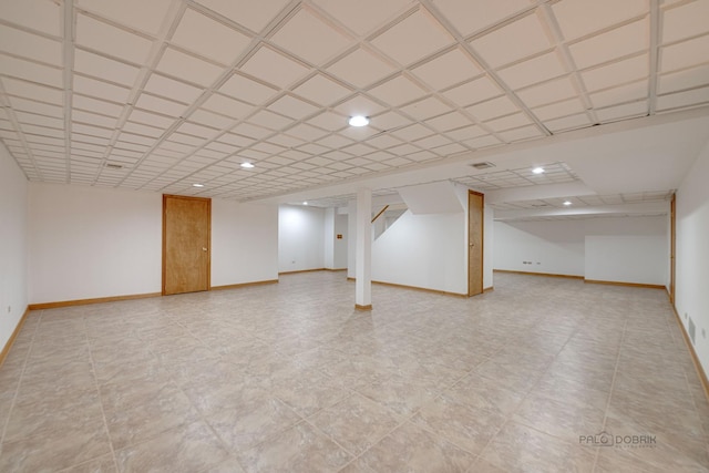 finished basement featuring recessed lighting and baseboards