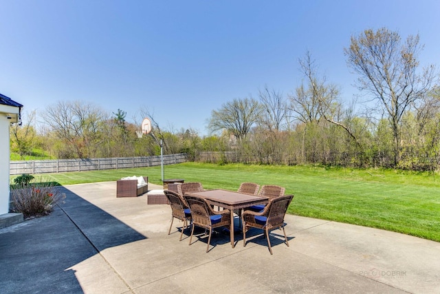 view of patio with outdoor dining space and a fenced backyard