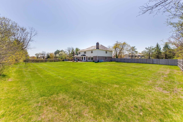 view of yard featuring a fenced backyard