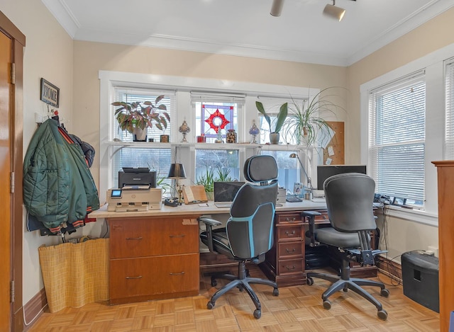 office space with ornamental molding, a wealth of natural light, and baseboards