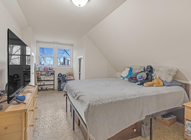 bedroom with lofted ceiling