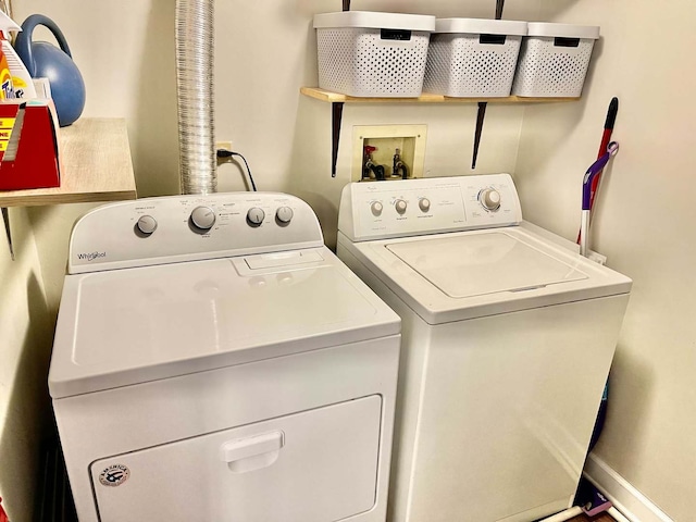 laundry area with laundry area and washer and clothes dryer