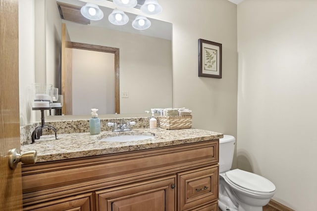 half bath with vanity and toilet