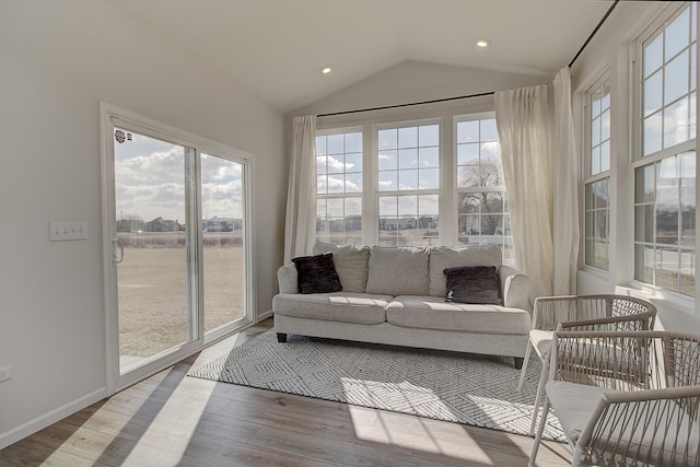 sunroom / solarium with lofted ceiling and plenty of natural light