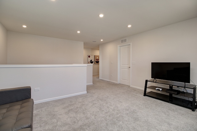 living area with carpet, visible vents, baseboards, and recessed lighting