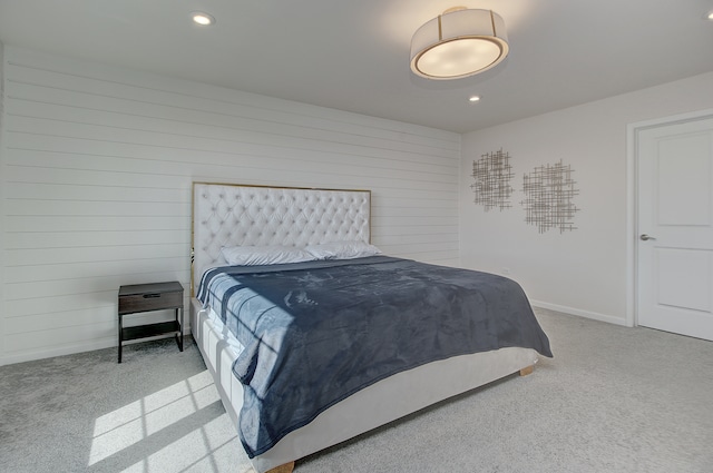 bedroom with carpet floors, recessed lighting, wooden walls, and baseboards