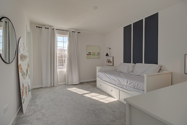 carpeted bedroom with baseboards