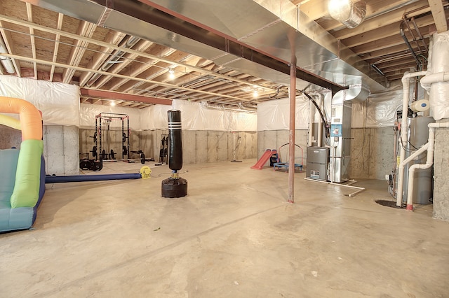 unfinished basement with water heater and heating unit