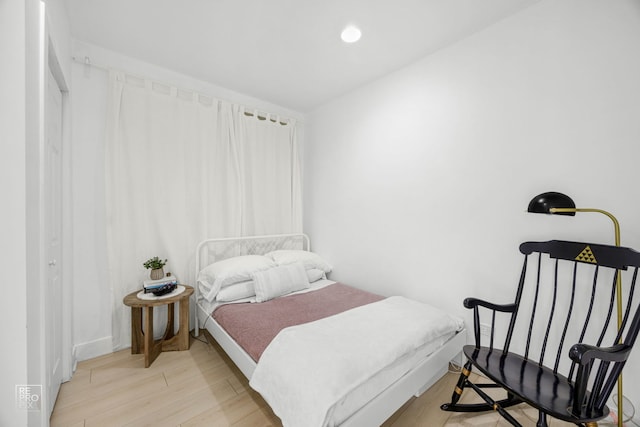 bedroom featuring recessed lighting and light wood-style floors