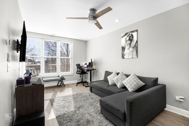 living room with a ceiling fan, recessed lighting, baseboards, and wood finished floors