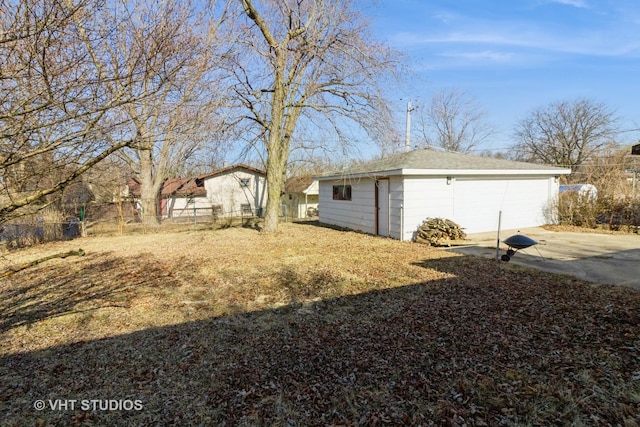 view of yard with an outdoor structure and fence