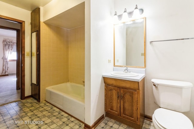 bathroom featuring vanity, baseboards, tub / shower combination, tile patterned floors, and toilet