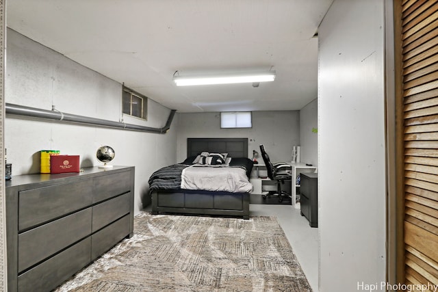 bedroom featuring concrete floors and visible vents