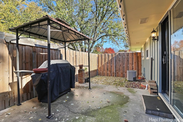 view of patio / terrace featuring grilling area, a fenced backyard, visible vents, and central air condition unit