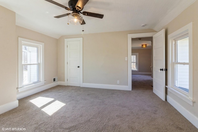 unfurnished bedroom featuring carpet floors, baseboards, and visible vents