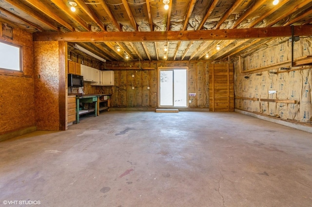 interior space with a healthy amount of sunlight and concrete floors