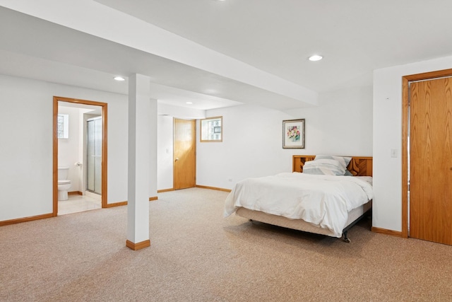 bedroom featuring baseboards, light carpet, connected bathroom, and recessed lighting