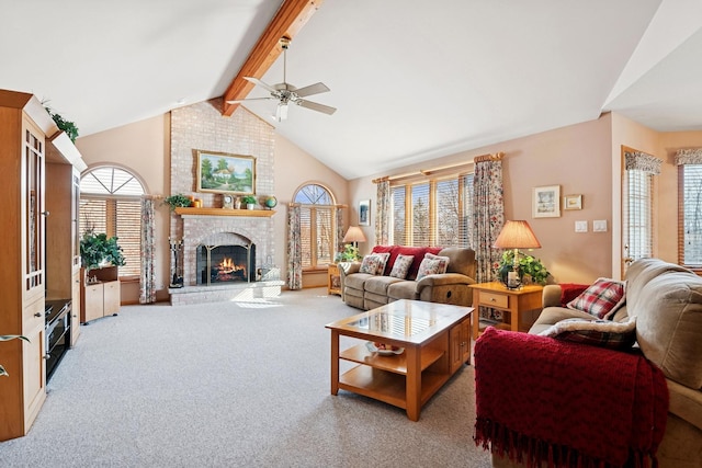 living area featuring carpet floors, beam ceiling, a brick fireplace, ceiling fan, and high vaulted ceiling