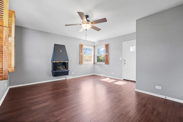 200 S Roselle Rd, Roselle, IL 60172 - unfurnished living room with ceiling fan, wood finished floors, and baseboards