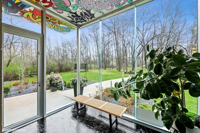 sunroom / solarium featuring plenty of natural light