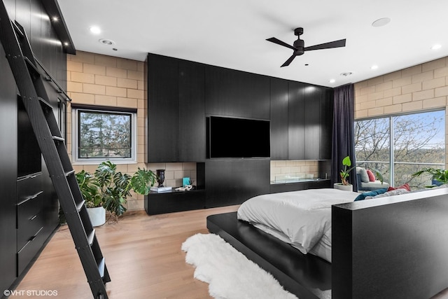 bedroom with recessed lighting and light wood finished floors