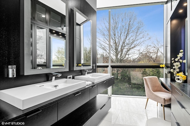 bathroom featuring double vanity, tile patterned flooring, and a sink