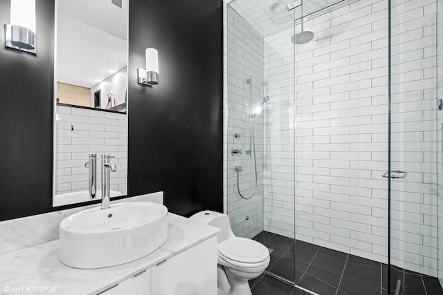 bathroom with toilet, a stall shower, tile patterned flooring, and vanity