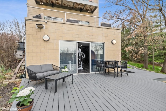 wooden deck featuring outdoor dining space