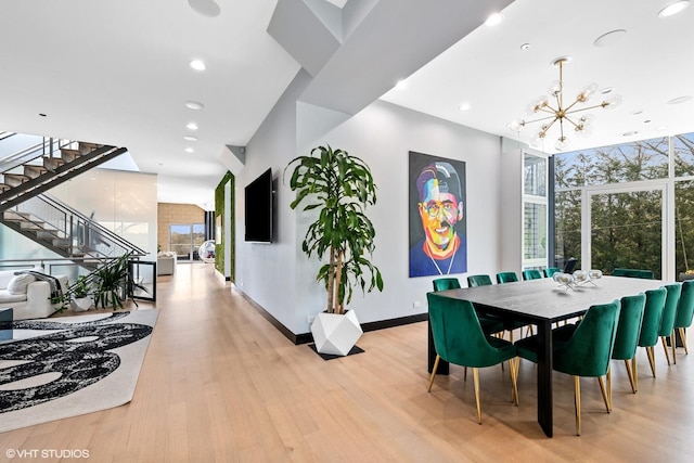 dining room with baseboards, stairway, light wood-type flooring, a chandelier, and recessed lighting