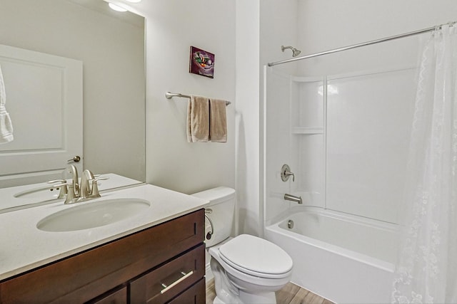 full bathroom with shower / tub combo, vanity, toilet, and wood finished floors