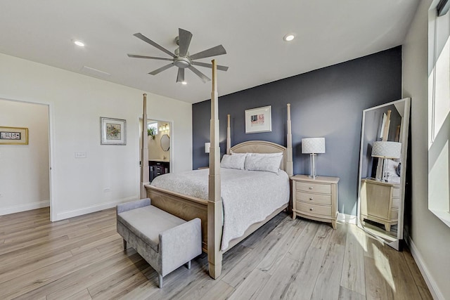 bedroom featuring light wood-type flooring, baseboards, and recessed lighting