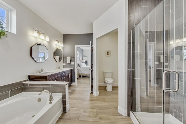 full bathroom with a garden tub, a sink, and a shower stall