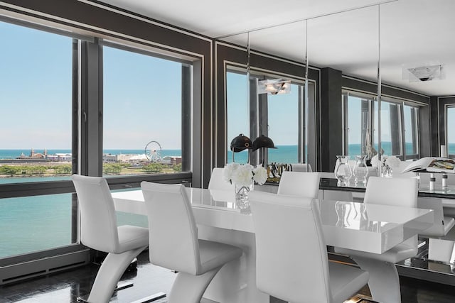 dining room featuring a water view