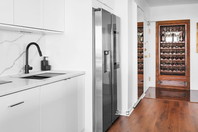 interior space with dark wood finished floors and a sink